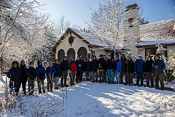 Scouts and leaders with loppers line up in the snow in front of the Visitor Center at Conference House Park, Staten Island, on Martin Luther King Jr. Day 2026