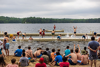 Scouts on the beach and in the swim area at a Camp Yawgoog waterfront, Rockville, Rhode Island, during Troop 23 Brooklyn's 2024 summer camp