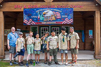 Troop 23 Brooklyn Scouts and adult leaders in front of the Billy & Keith Johnson Scout Center at Camp Aquehonga, Ten Mile River Scout Camps, on the last day of summer camp, July 11, 2026