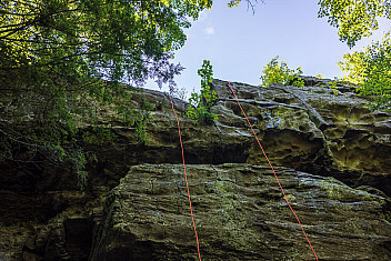 A rappel line down the rock face of Indian Cliffs at Ten Mile River Scout Camps, New York, July 2026