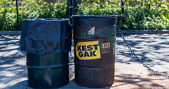 Two trash cans after repainting on the Shore Parkway Greenway in Bay Ridge, Brooklyn, during Jalen's Eagle Scout project, May 16, 2026