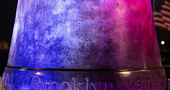 The base of the Beacon on the American Veterans Memorial Pier, lit at night, with the words "Brooklyn Remembers" cast in the bronze, September 11, 2025