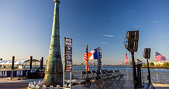 The Beacon on the 69th Street Pier The Beacon, the bronze 9/11 memorial on the American Veterans Memorial Pier in Bay Ridge, with the stage set for the vigil and the Manhattan skyline across the harbor, September 11, 2025