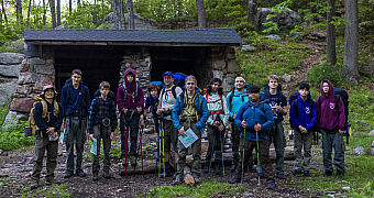 Morning at the William Brien Memorial Shelter Troop 23 Brooklyn backpackers gather in front of the William Brien Memorial Shelter, a stone lean-to in Harriman State Park, before setting out, May 25, 2024