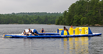 Adventure Island at Camp Yawgoog Scouts on Adventure Island, the inflatable obstacle course on the water at Camp Yawgoog, Rhode Island, July 2024