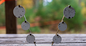 Steel spinner targets marked with hits on a bench at the BB gun range, Camp Keowa, Ten Mile River Scout Camps, October 2025