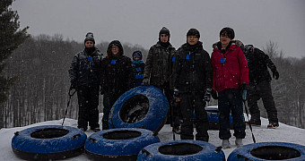 Snow Tubing — Troop 23 Winter Weekend, 2025 Troop 23 Brooklyn Scouts with snow tubes at the top of a tubing hill, February 2025 winter weekend at Ten Mile River