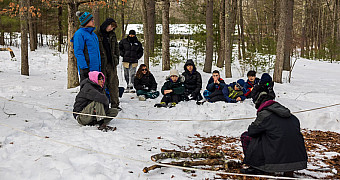 Troop 23 Brooklyn Scouts gathered for a lesson in the snowy woods at Ten Mile River Scout Camps, February 2026